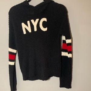 black nyc sweater with a hoodie